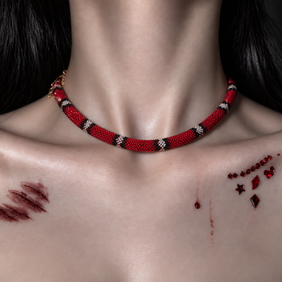 Crimson Serpent worn at the collarbone